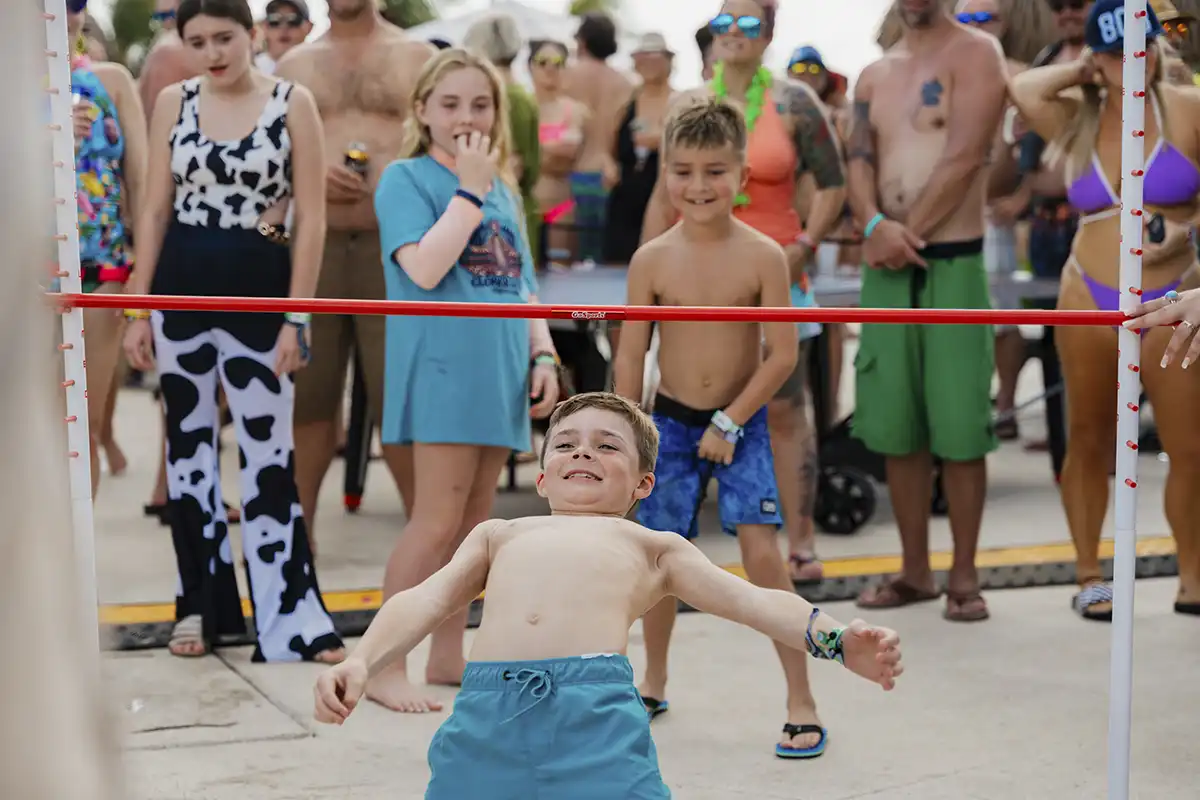 Children participating in a limbo content.