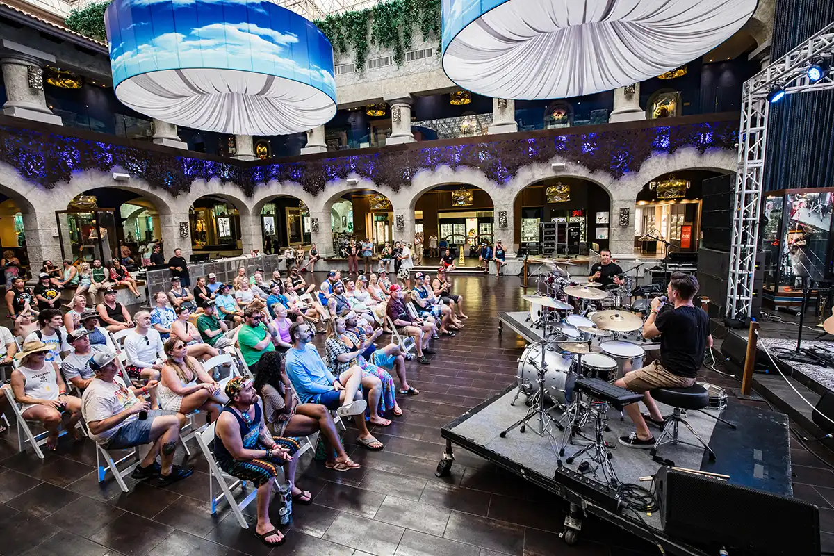 Guests watching Ry Mo from Slightly Stoopid host a drumming workshop.