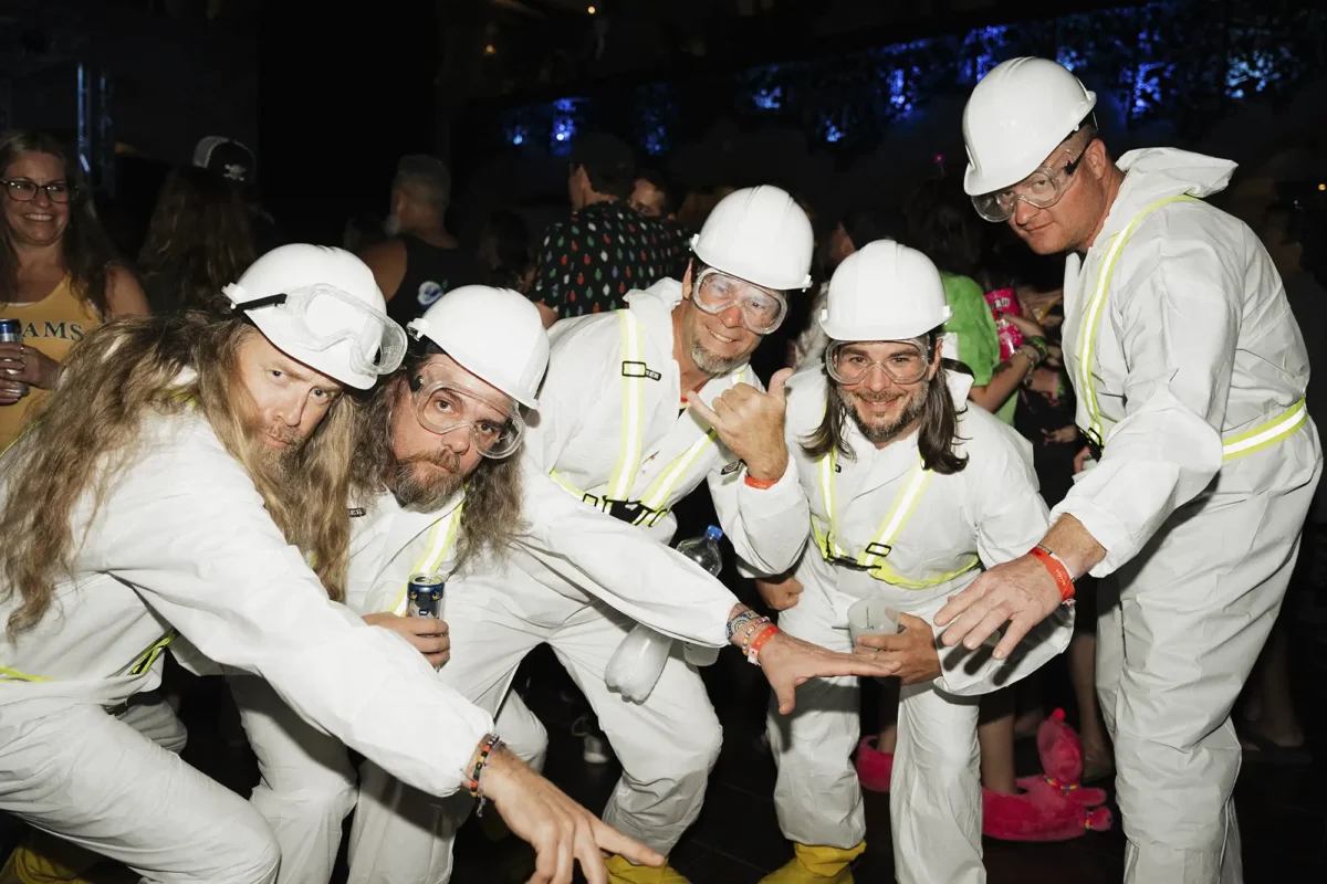 Group photo posing in matching theme night costumes.